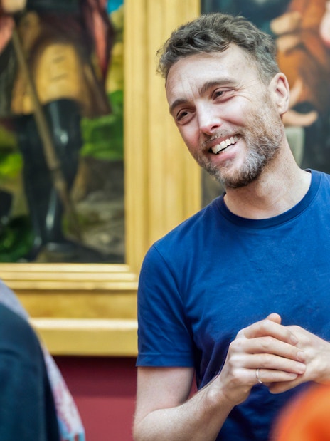 Guide explaining artwork during National Gallery tour.