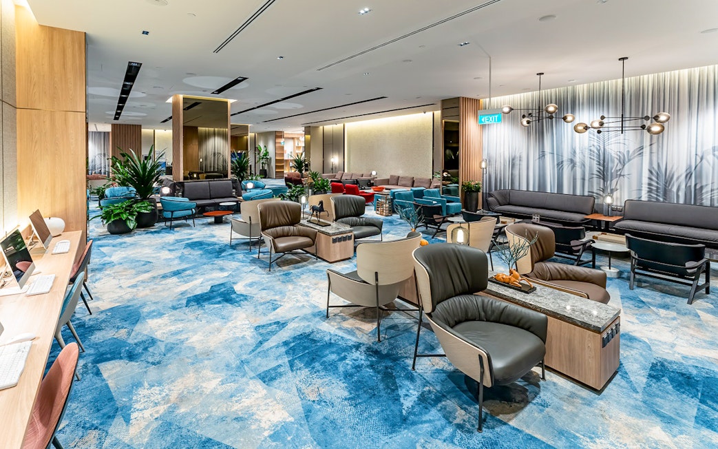Changi Lounge interior with seating areas and modern decor, Singapore.