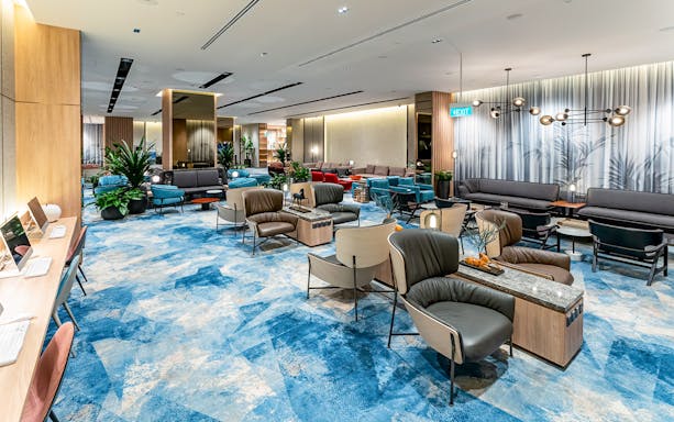 Changi Lounge interior with seating areas and modern decor, Singapore.