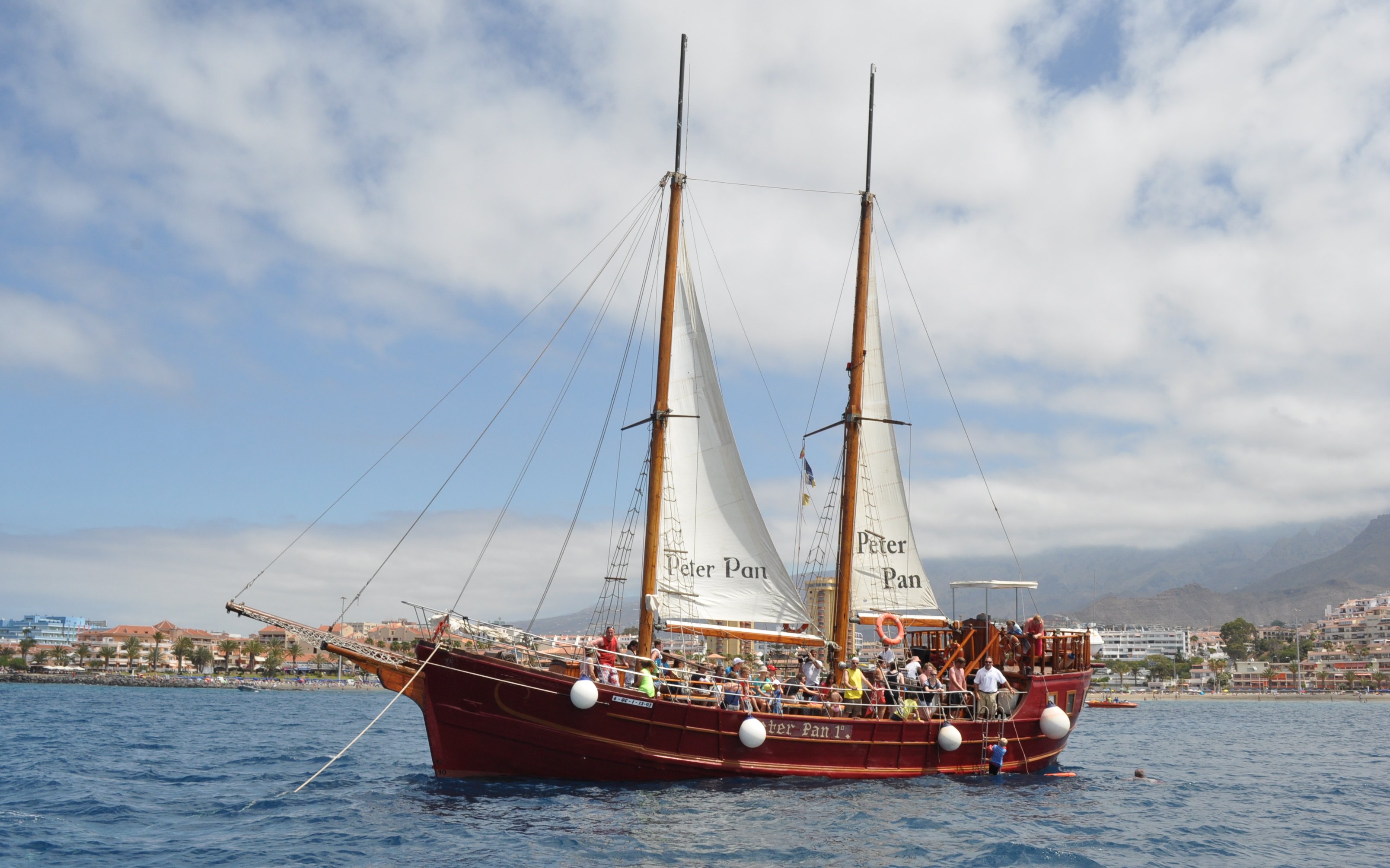 Tourists on Peter Pan Pirate boat for whale and dolphin watching in Tenerife.