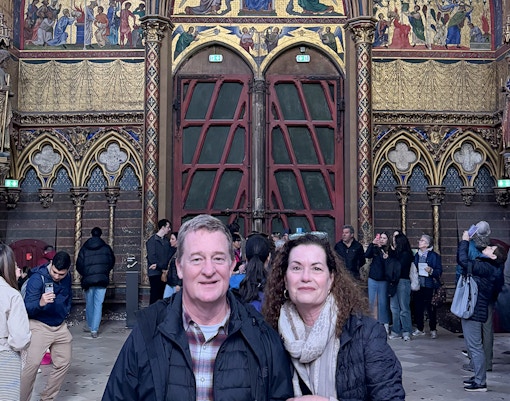 Couple getting a picture at Sainte Chapelle