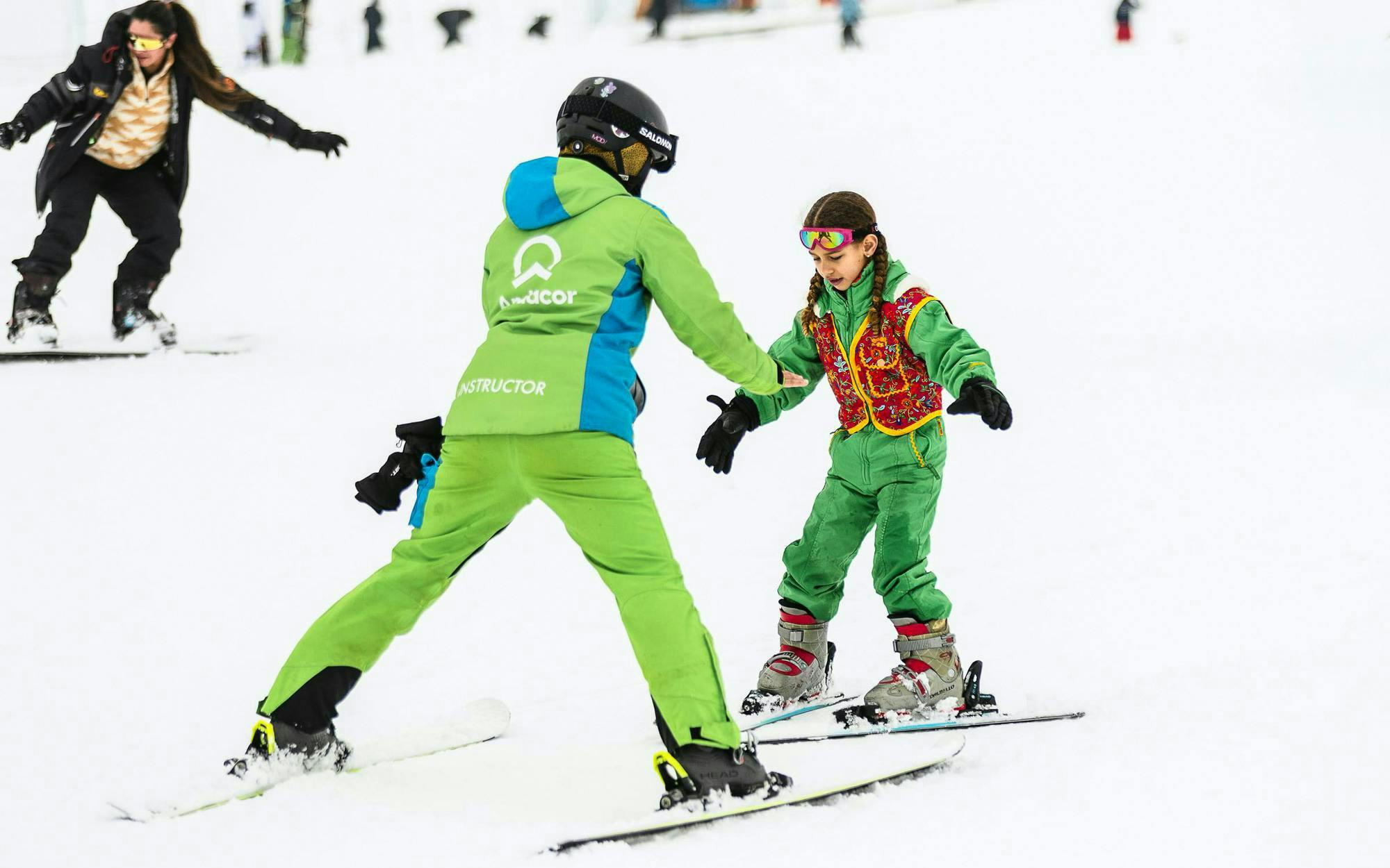 Child learning to ski with instructor at Farellones Ski, Chile.