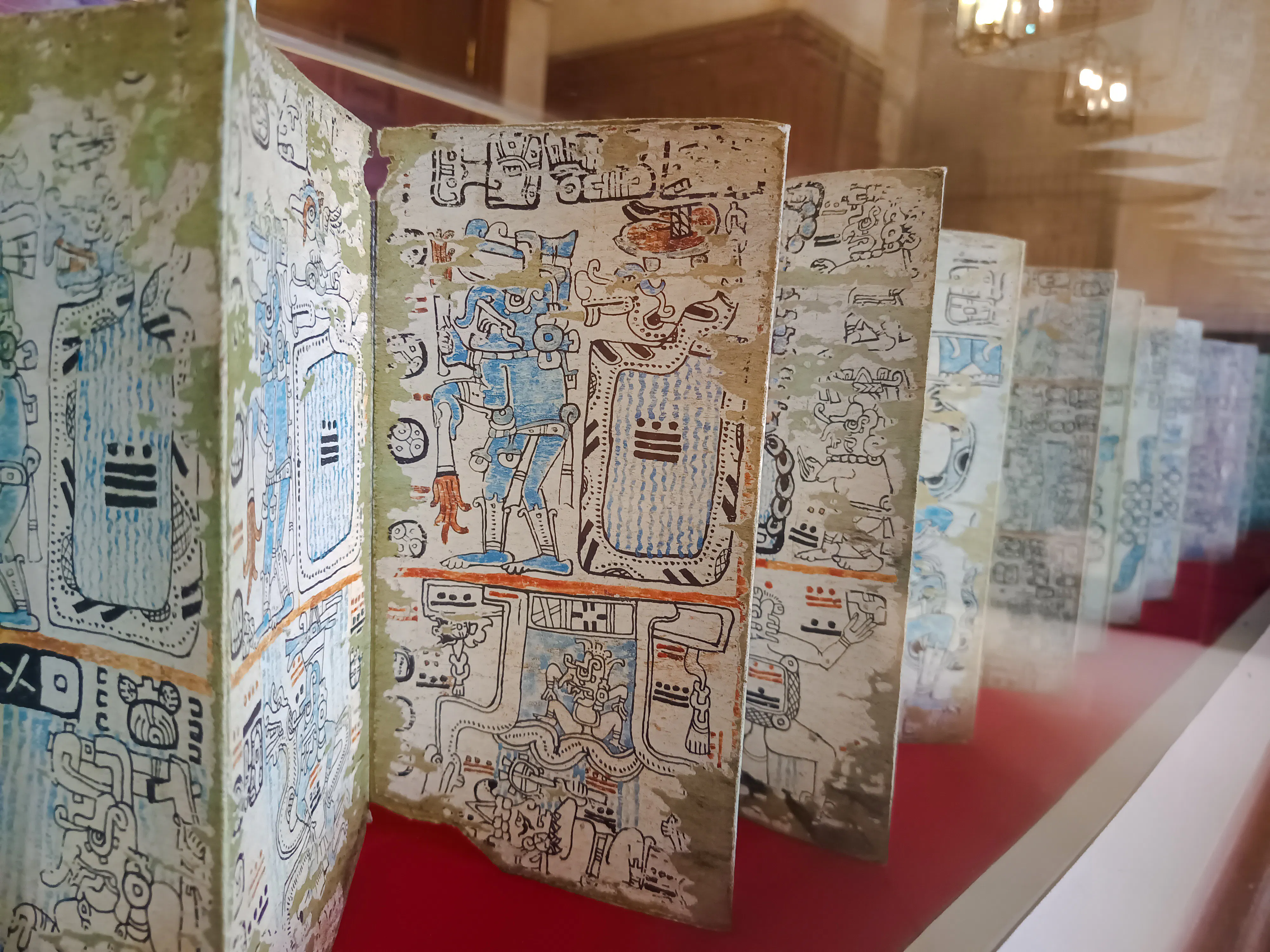 Ancient manuscript with intricate drawings at a museum in Santo Domingo.