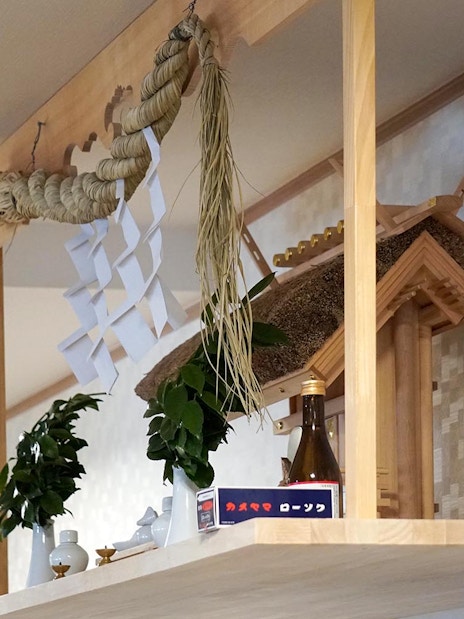 Sumo stable altar with traditional decorations and offerings in Japan.