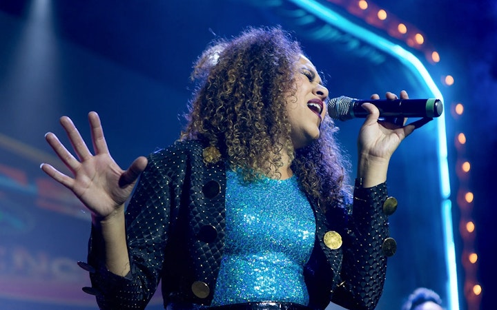 Singer performing at The Jets: Back to the 80's & 90's Experience concert.