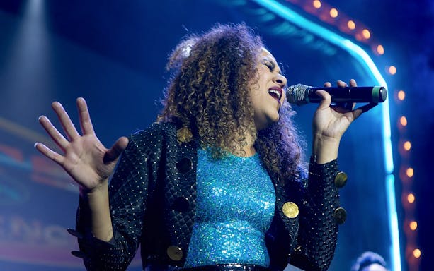 Singer performing at The Jets: Back to the 80's & 90's Experience concert.