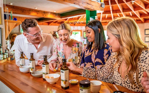 Group tasting olive oil at Allpress Olive Groves.