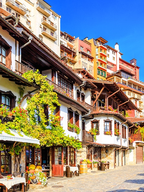 Old town street with traditional houses in Veliko Tarnovo, Bulgaria.
