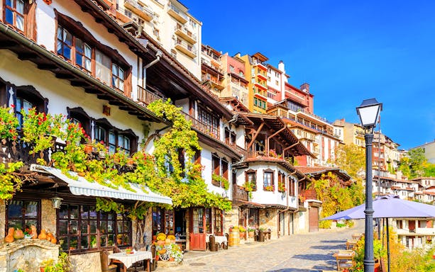 Old town street with traditional houses in Veliko Tarnovo, Bulgaria.