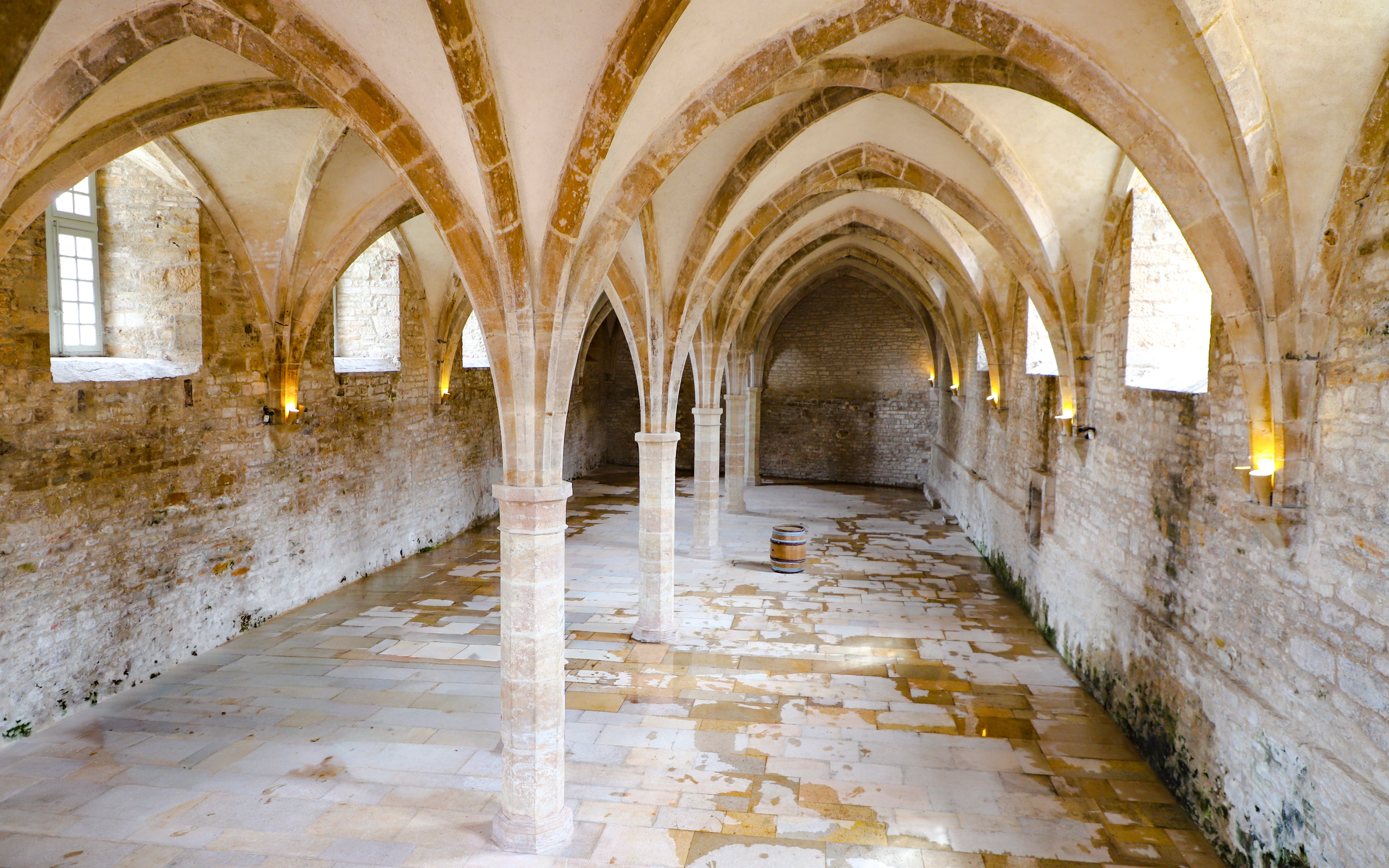 Vaulted stone hall inside Cluny Abbey, Lyon, France.