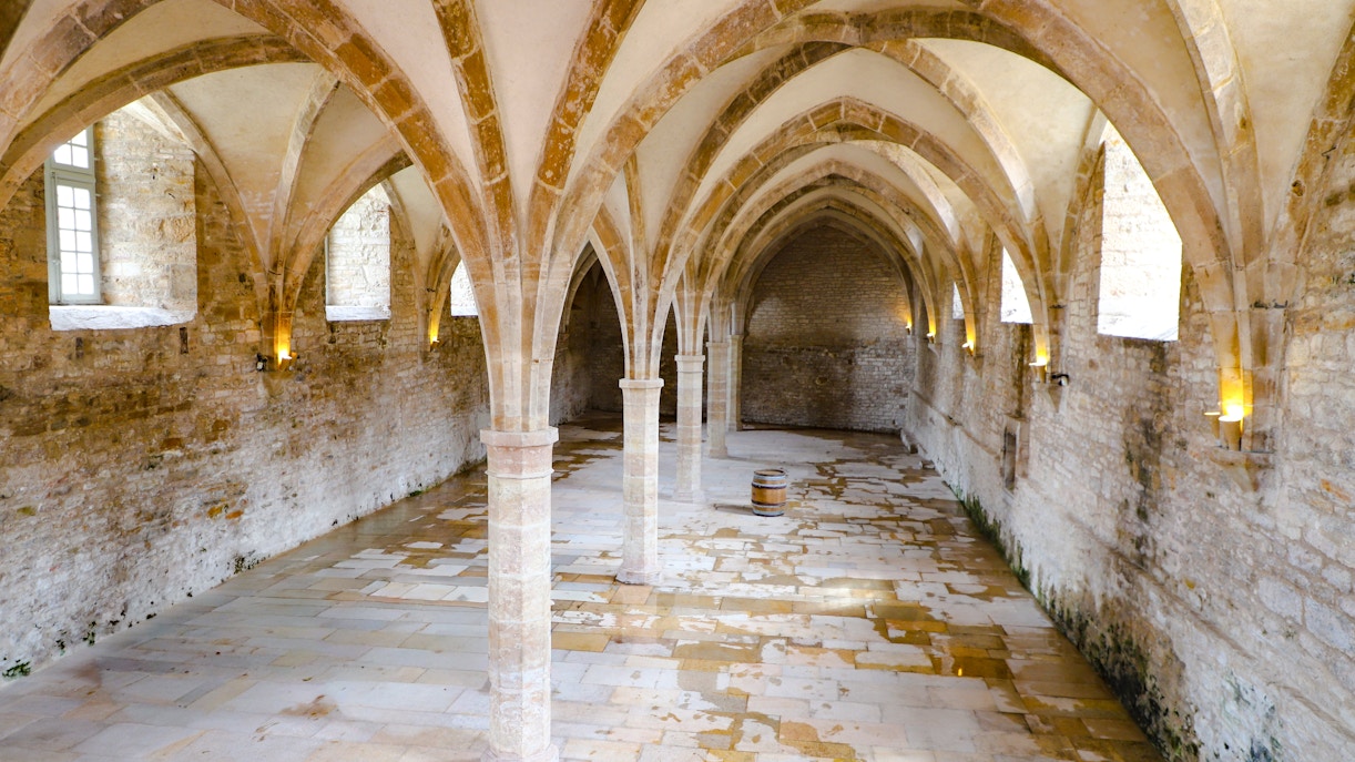Vaulted stone hall inside Cluny Abbey, Lyon, France.