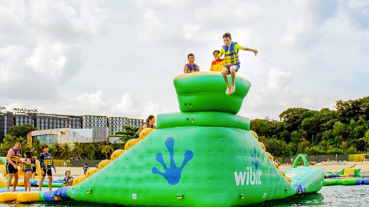 Participants enjoying inflatable obstacle course at HydroDash Singapore.