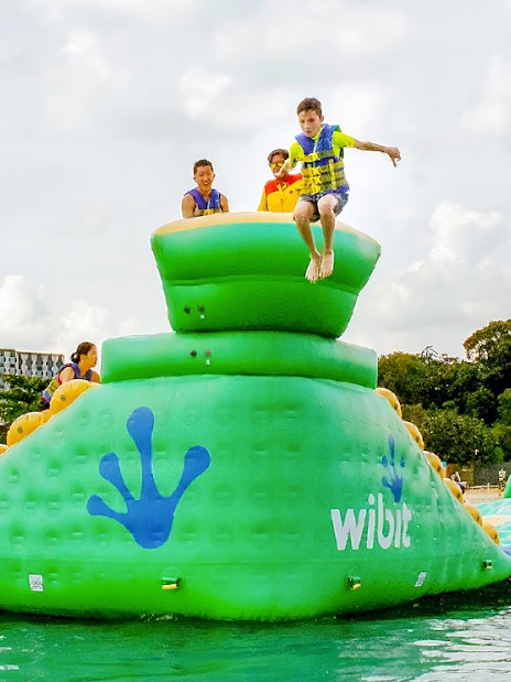 Participants enjoying inflatable obstacle course at HydroDash Singapore.