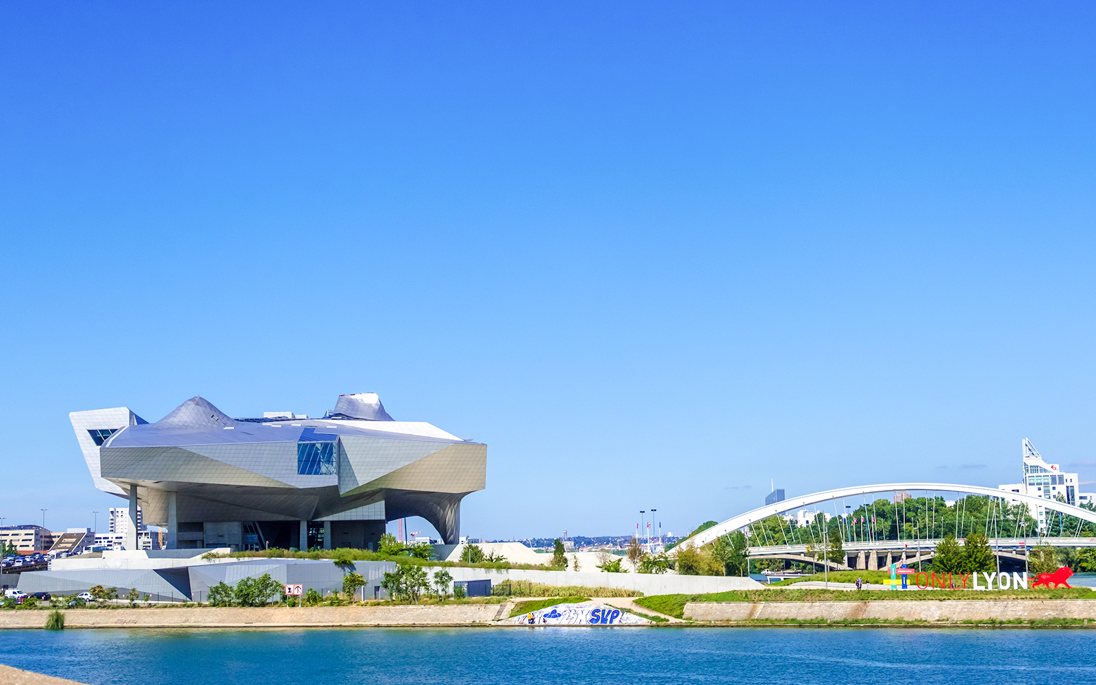 Musee des Confluences in Lyon with modern architecture by the river.