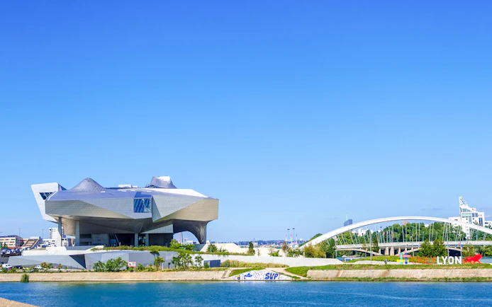 Musee des Confluences in Lyon with modern architecture by the river.