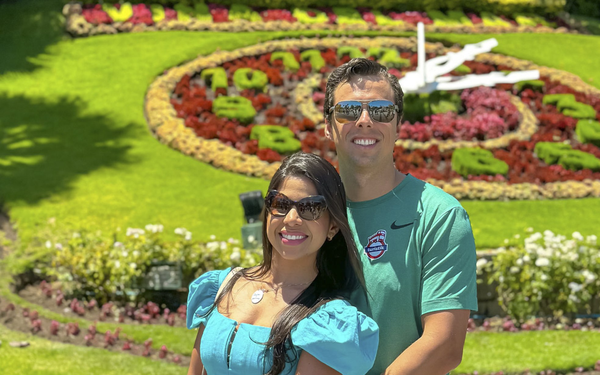 Tourists posing in front of the floral clock garden in Valparaíso.