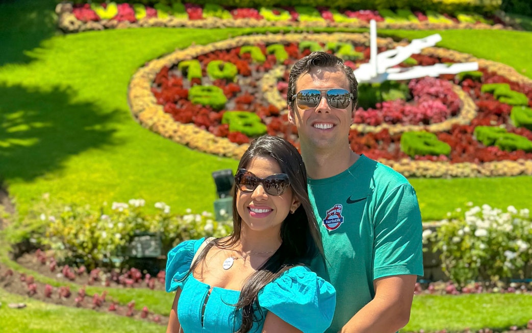 Tourists posing in front of the floral clock garden in Valparaíso.