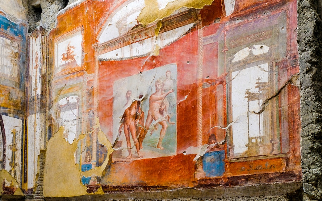 Fresco of Neptune and Aimone on a vibrant wall in Ercolano, showcasing ancient Roman art.