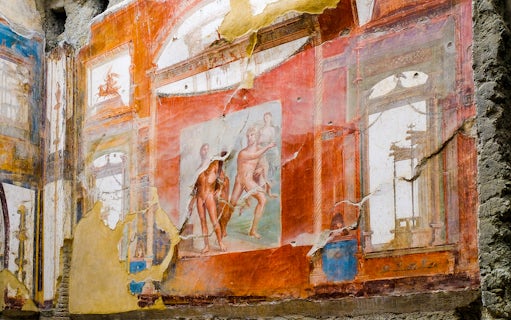 Fresco of Neptune and Aimone on a vibrant wall in Ercolano, showcasing ancient Roman art.