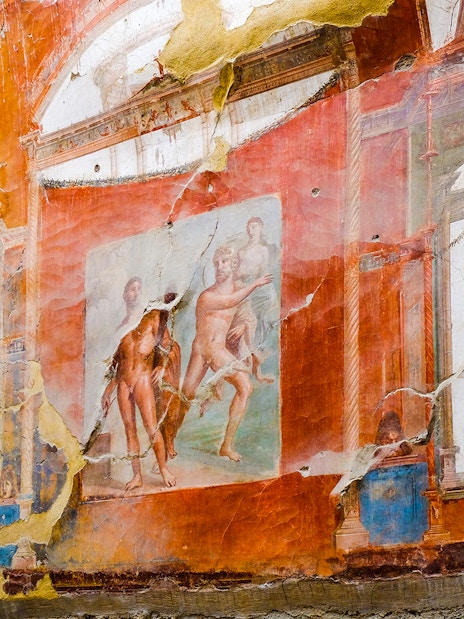 Fresco of Neptune and Aimone on a vibrant wall in Ercolano, showcasing ancient Roman art.