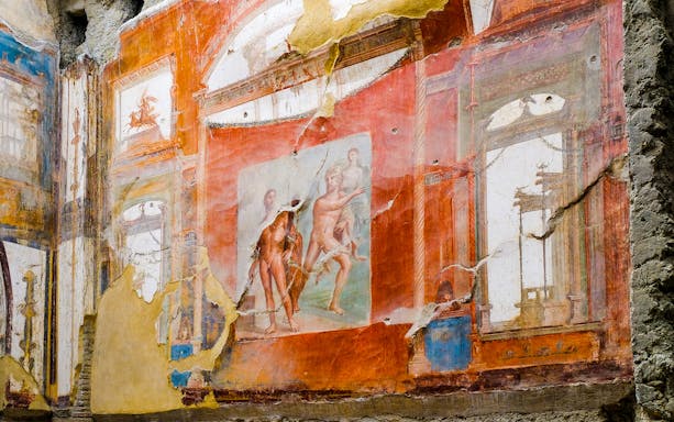Fresco of Neptune and Aimone on a vibrant wall in Ercolano, showcasing ancient Roman art.