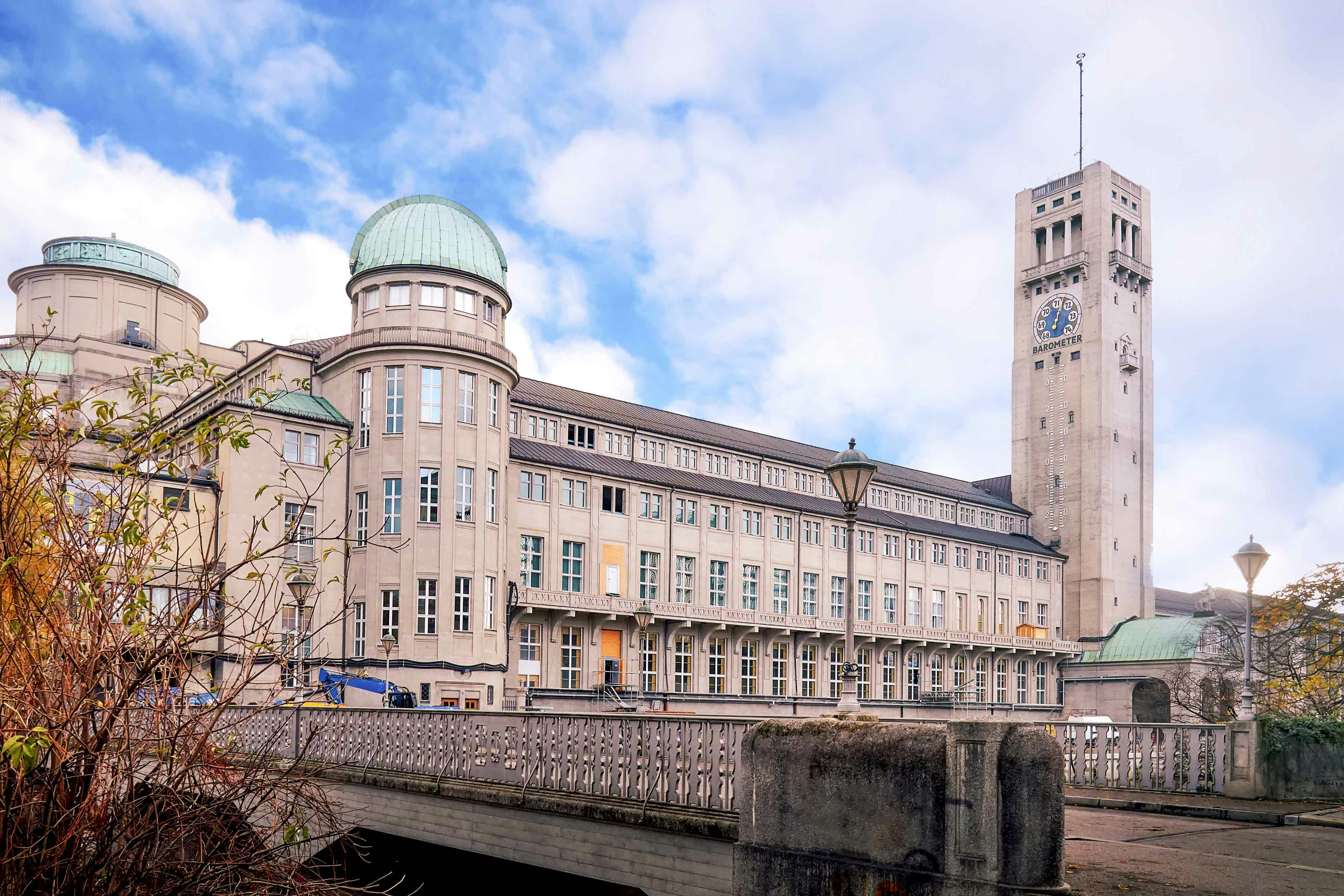 Deutsches Museum exterior with visitors exploring the entrance in Munich, Germany.