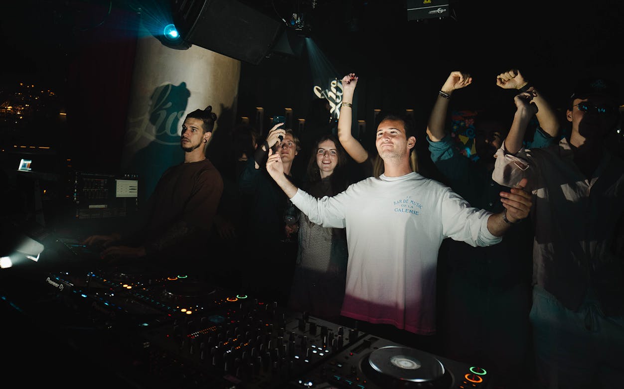People enjoying a DJ performance at Bâzâr by Sasson nightclub.