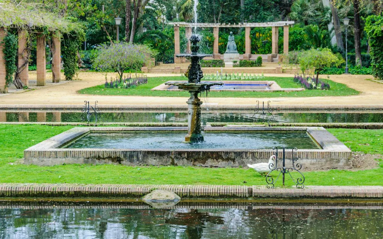 Fountain in a garden at Maria Luisa Park, Seville, seen on a city tuk tuk tour.