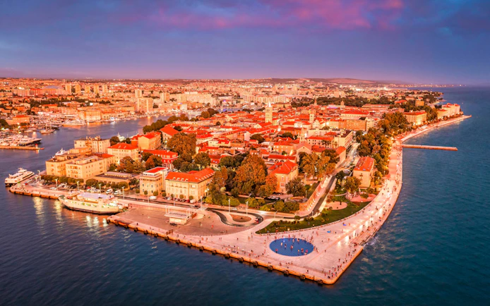 Aerial view of Zadar's old town with the Greeting to the Sun monument and Sea Organ, Croatia.