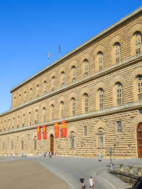 Pitti Palace exterior with visitors, Florence, Italy.