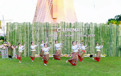 Thai dancers performing traditional dance in colorful attire at Chiang Mai Sky Lanterns Festival.