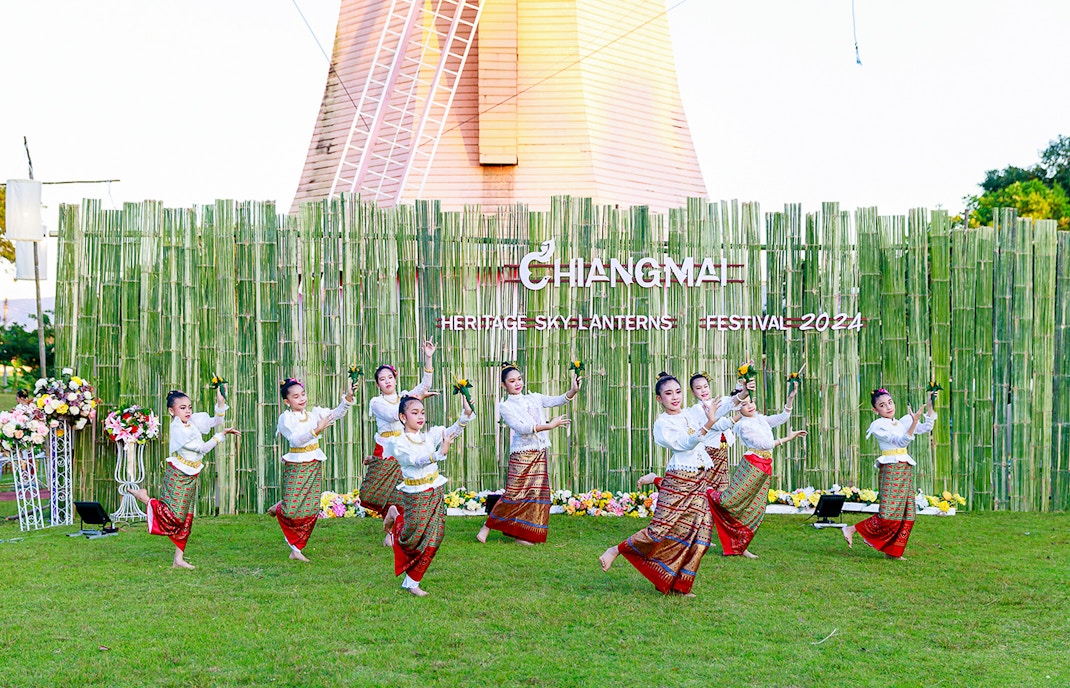 Thai dancers in traditional attire performing at Chiang Mai Sky Lanterns Festival.