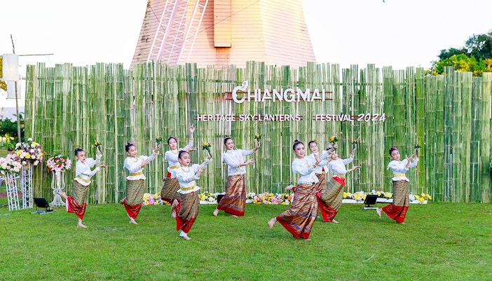 Thai dancers in traditional attire performing at Chiang Mai Sky Lanterns Festival.