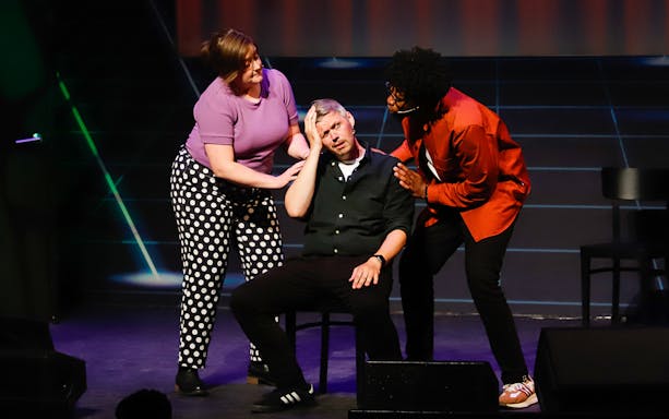 Actors performing a scene at Boom Chicago Improv Comedy Show in Amsterdam.