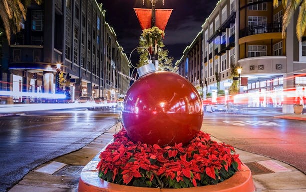 Holiday lights and large ornament on San Francisco street during Big Bus Tours.