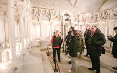 Tour group exploring interior of Santiago de Compostela Cathedral.