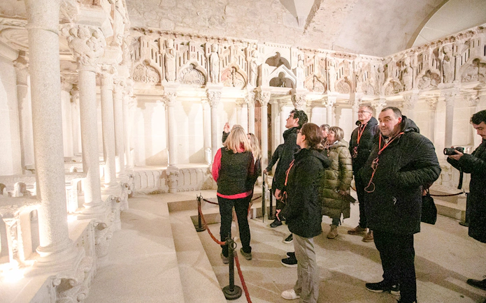 Tour group exploring interior of Santiago de Compostela Cathedral.