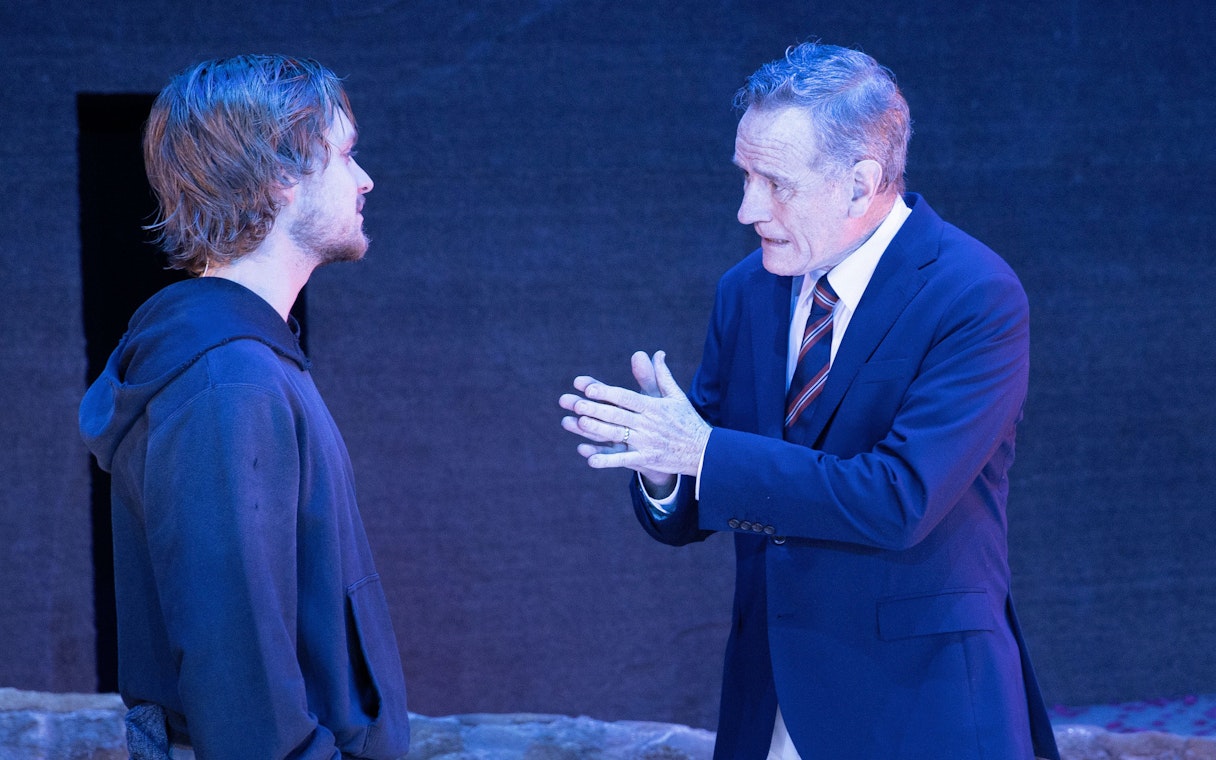 Actors in a scene from the West End show "All My Sons" performing on stage.