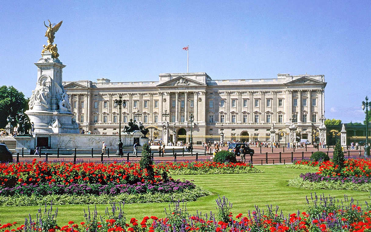 Buckingham Palace with Victoria Memorial and gardens in London.