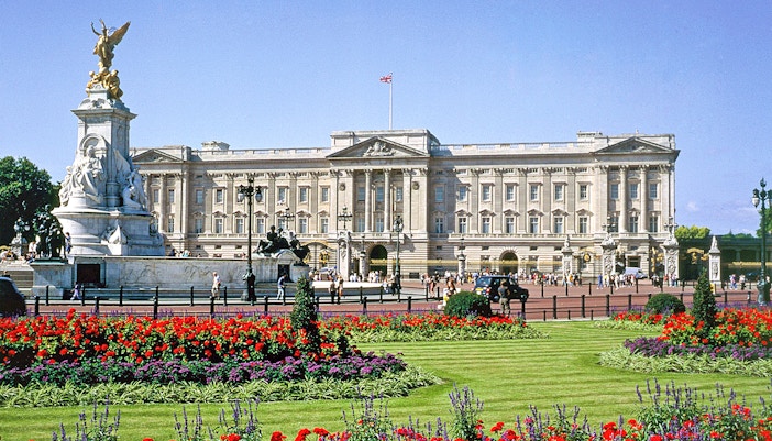 Buckingham Palace with Victoria Memorial and gardens in London.