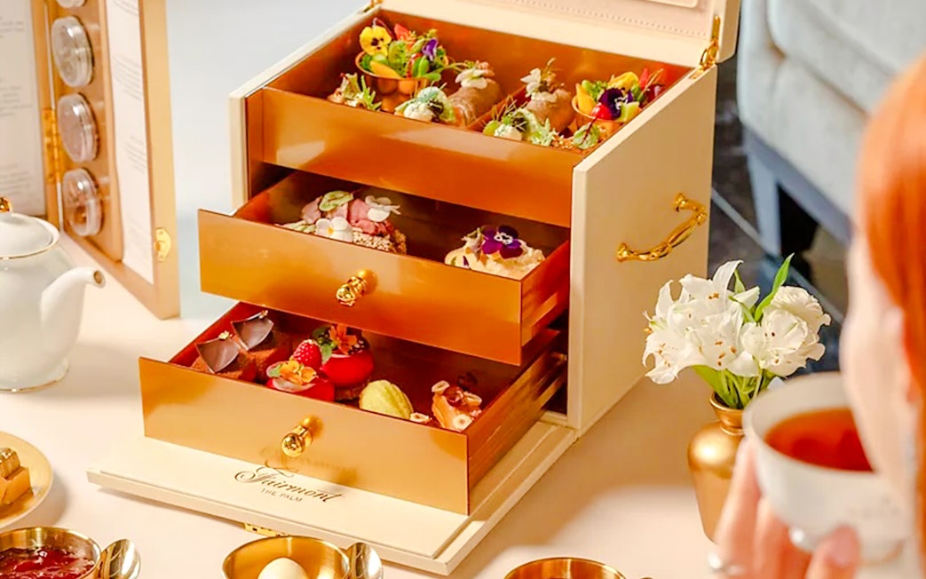 Afternoon tea set with pastries in a drawer at Fairmont Hotel.