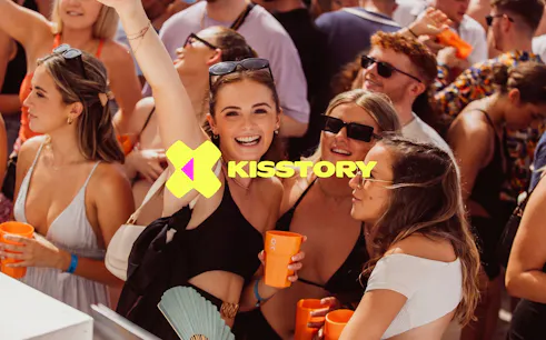 Partygoers enjoying Kisstory event at O Beach Ibiza with drinks and music.