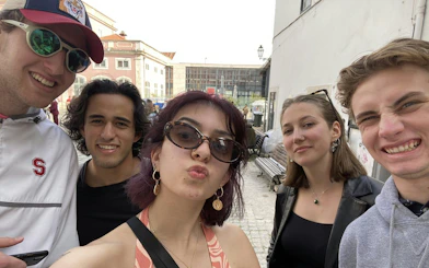 Group of friends enjoying a self-guided Fado murder mystery tour in Lisbon.