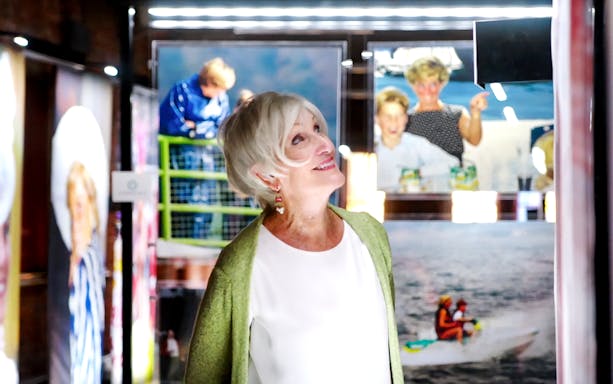 Visitor admiring Princess Diana photographs at Accredited Access Exhibition.