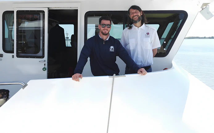 Boat crew on deck for Venice afternoon tour to Murano and Burano from Punta Sabbioni.