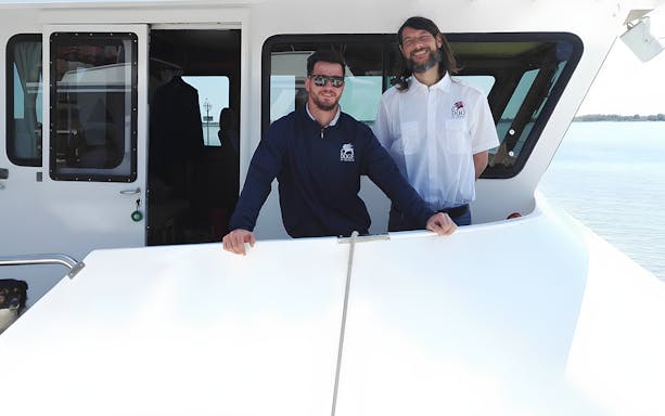 Boat crew on deck for Venice afternoon tour to Murano and Burano from Punta Sabbioni.