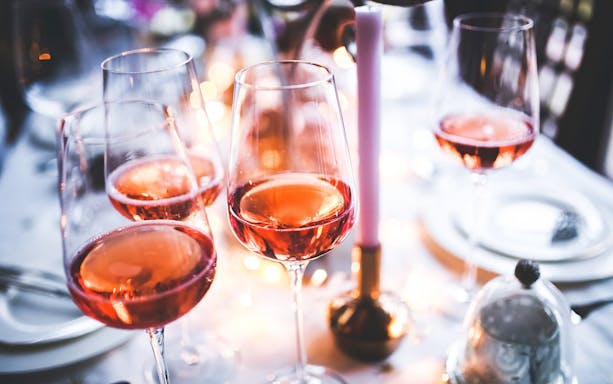 Glasses of red wine on a table during a Krakow wine and food tour.