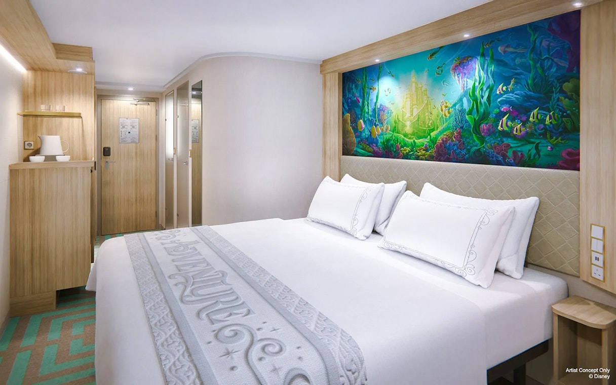 Deluxe Inside Stateroom with reef-themed decor on Disney Adventure Cruise.