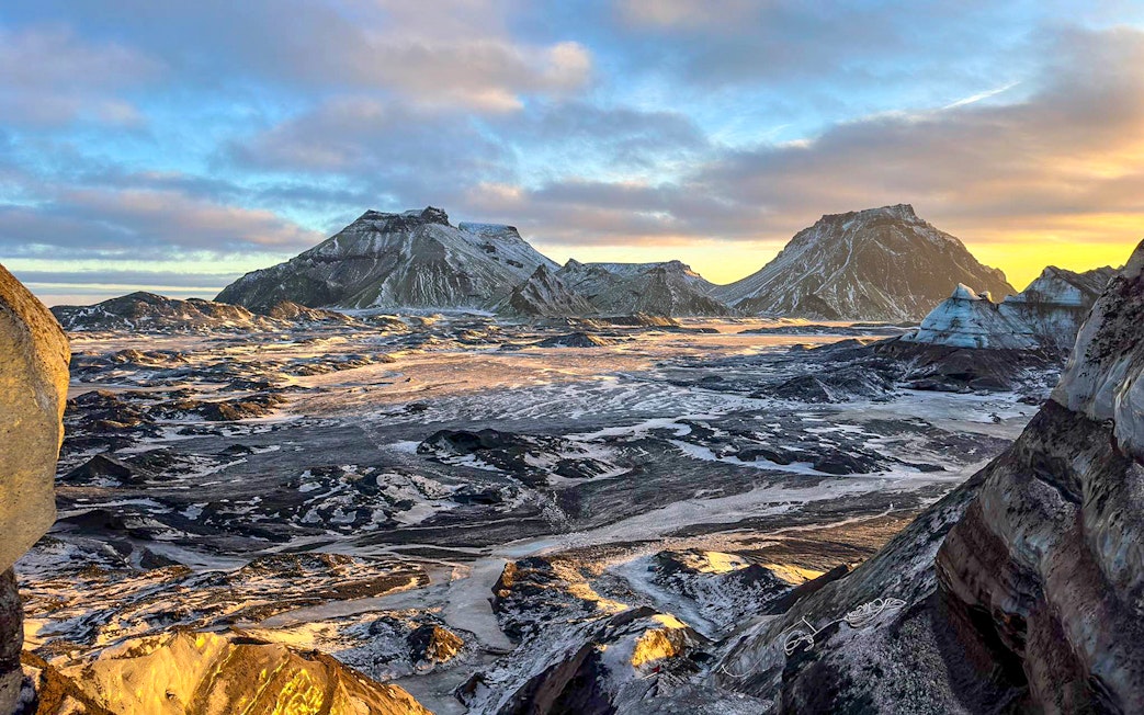 South Coast landscape with snow-covered mountains during Reykjavik tour.