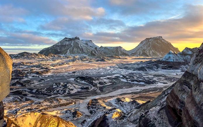 South Coast landscape with snow-covered mountains during Reykjavik tour.